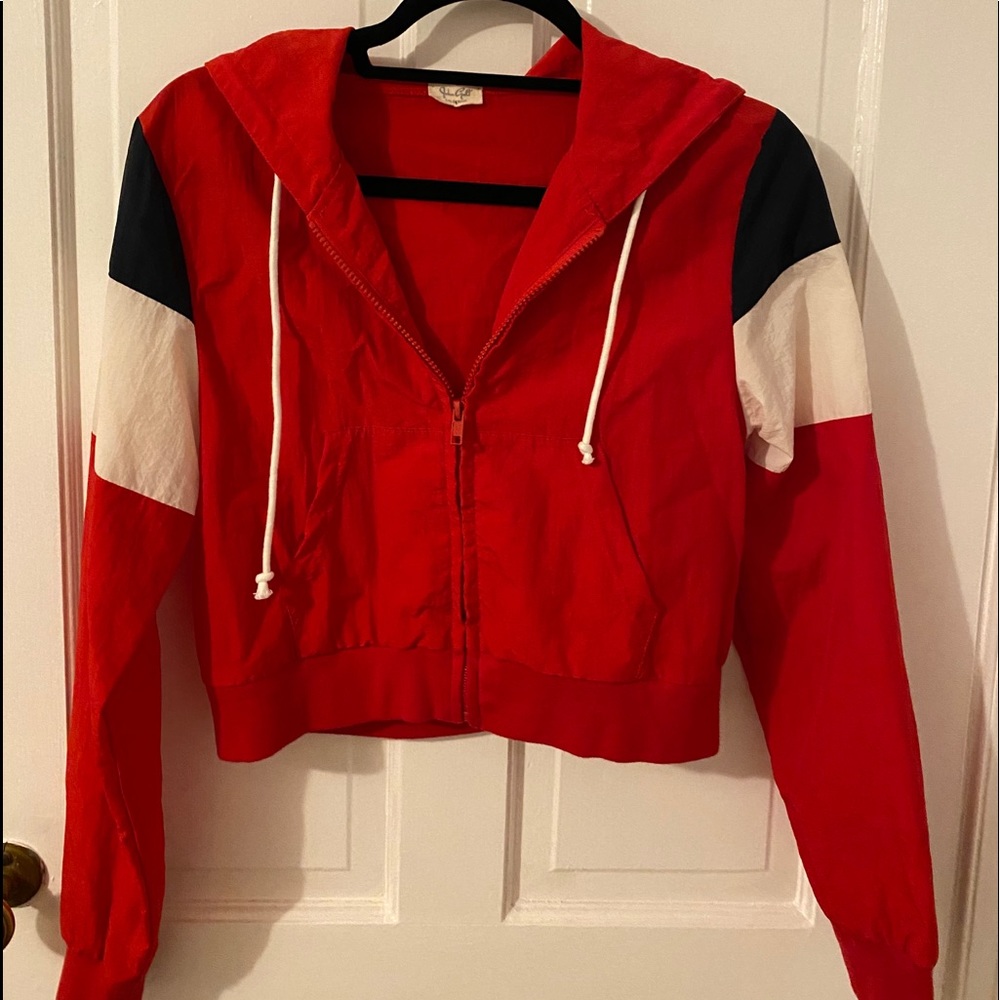 Cropped red, white and blue rain jacket.